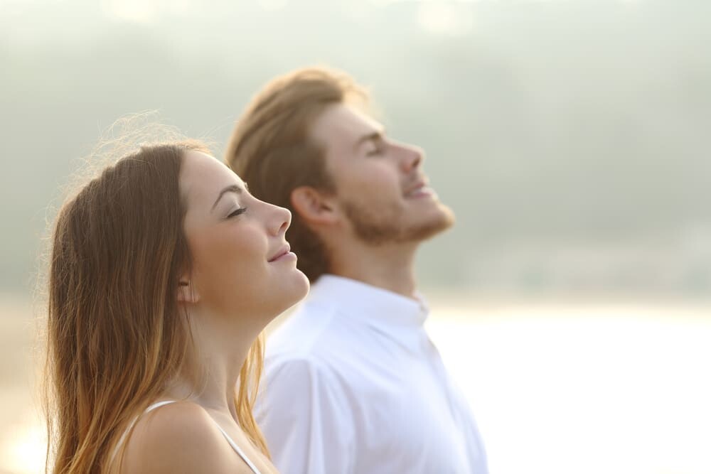 Couple of man and woman breathing deep fresh air как почувствовать радость жизни